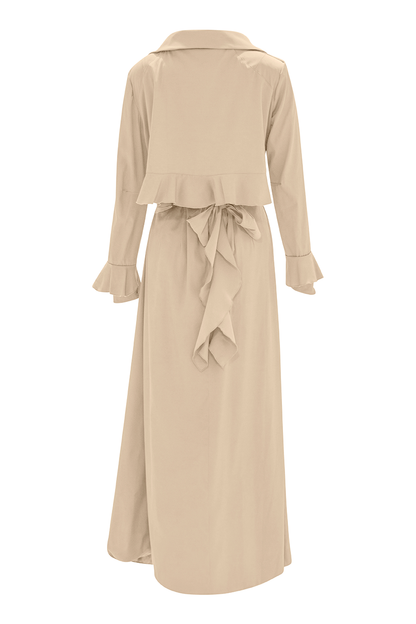 Wrap yourself in sophistication with our Beige Cascade Belted Trench Coat, a timeless essential for any wardrobe. With its ankle-length silhouette and dart fitted waist, this coat offers a flattering silhouette for every body type, making it perfect for both casual and formal occasions.